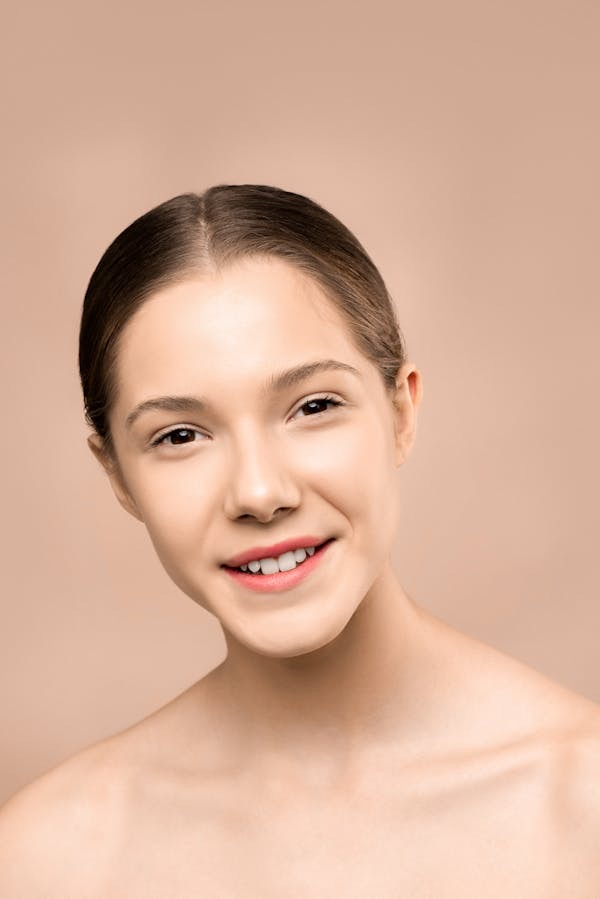 Woman with smooth, clear skin after laser scar treatment