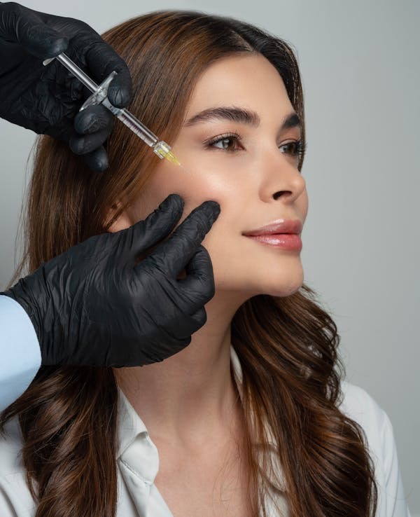 Dermal filler injection being administered for facial rejuvenation