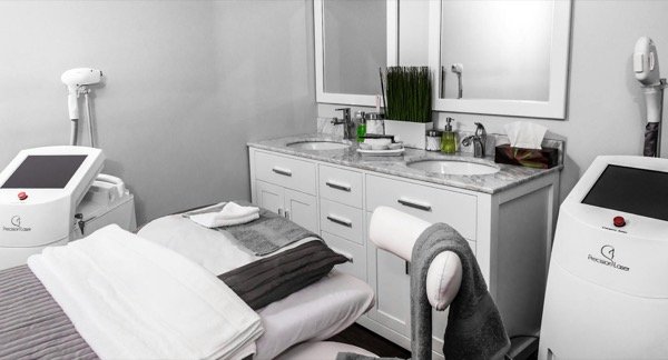 Serene spa treatment room with warm candlelight at Solara Aesthetics